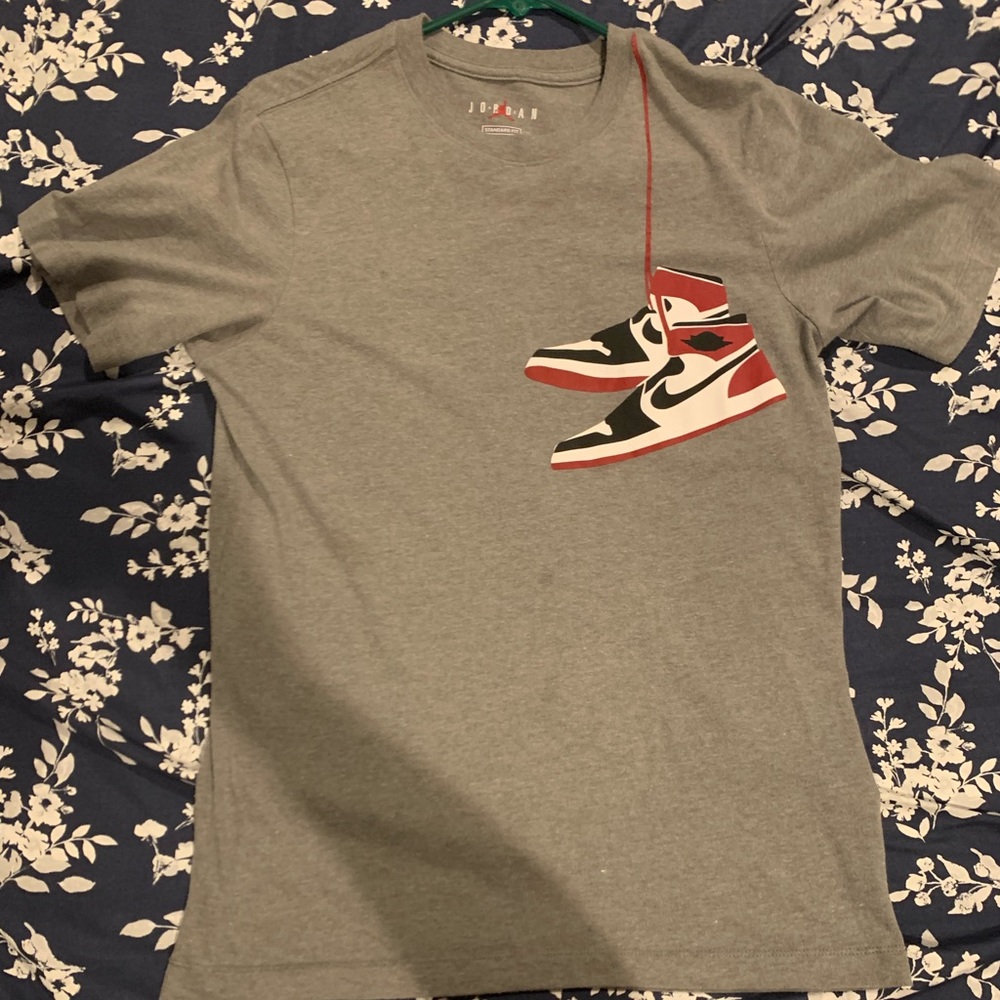 Grey Jordan T-shirt. Size S. Tiny hole on side of shirt.